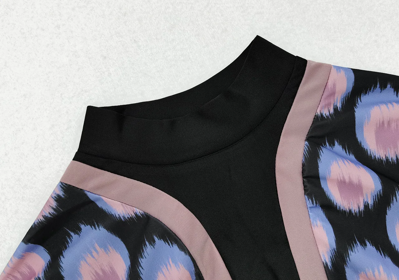 Three-piece conservative burkini featuring chic purple patterns and modest black details.