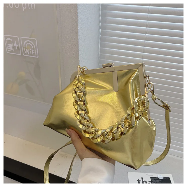 CaRaUaNa UNIU Aurora Clutch worn on shoulder