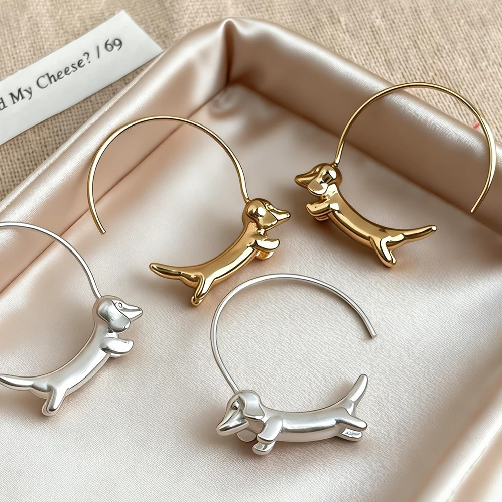 Minimalist Wiener dog earrings worn by woman