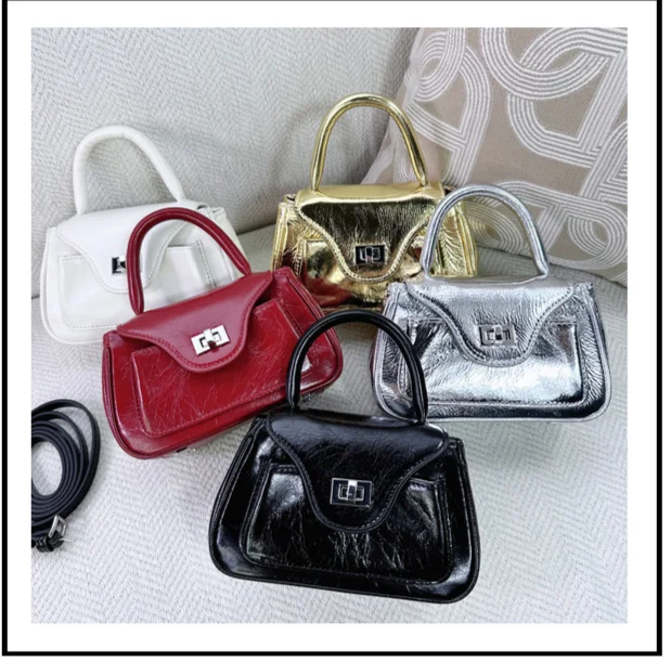 2024 Nieuwe Koreaanse niche-ontwerp hoofdlaag oliewas koeienhuid draagbare crossbody tas, schouder crossbody, eenvoudig en casual_voghion.com