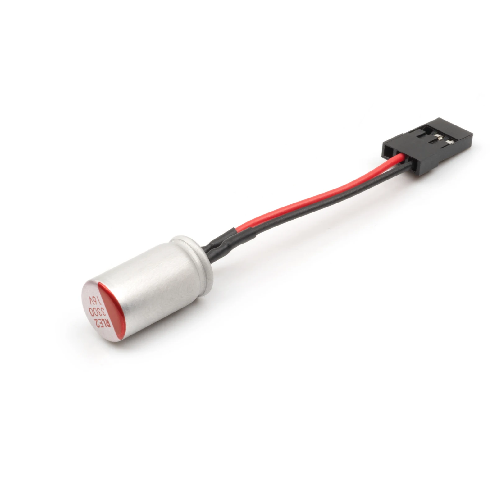 Condensateur 3300µF 16V pour Drone FPV, à côté d'une pile pour échelle de taille.