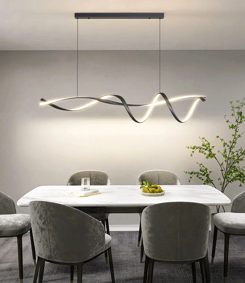 A modern dining room showcases a white marble table and gray upholstered chairs, highlighted by a Stylish Pendant Light. A minimalist plant adds a nature-inspired touch to elevate the space's elegance.