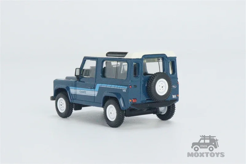 MINI GT 1:64 Land Rover Defender 90 County Wagon Stratos Blue RHD