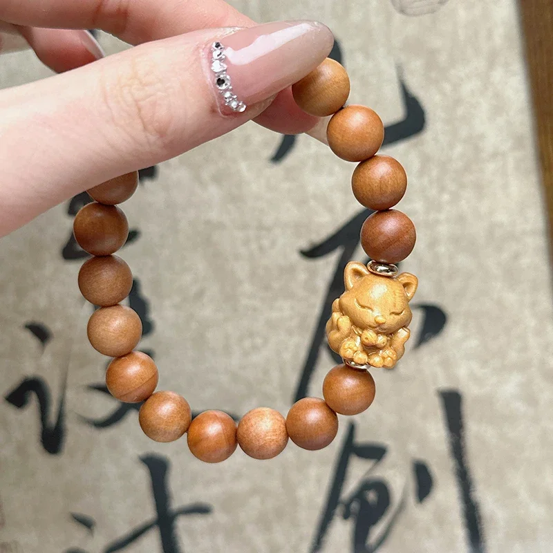 

Sandalwood round beads paired with sandalwood carving, nine tailed fox wood bracelet for men and women to play with