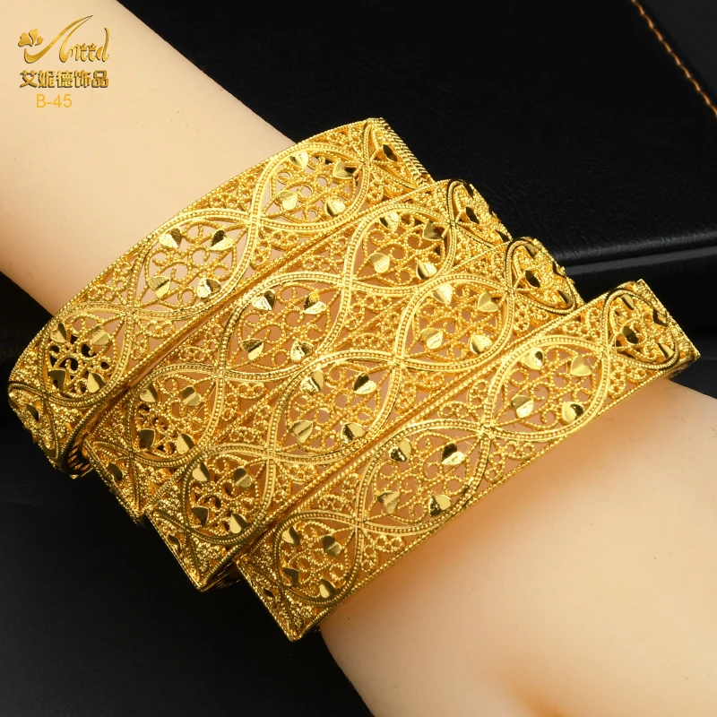 Womens Jewellery ARKET Wide Gold-plated Armlet in Metallic 