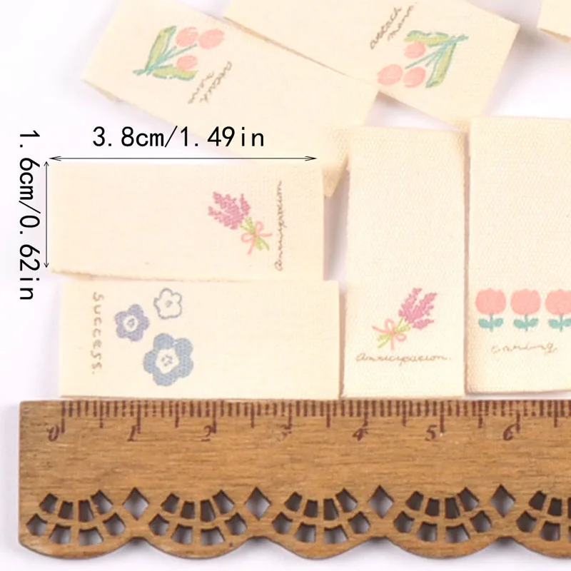 Description Picture 3 of item50pcs 16*38mm Mixed Flower Pattern Handmade Cotton Woven Label For Clothing Labels Cartoon Shoes Bags Garment Tags