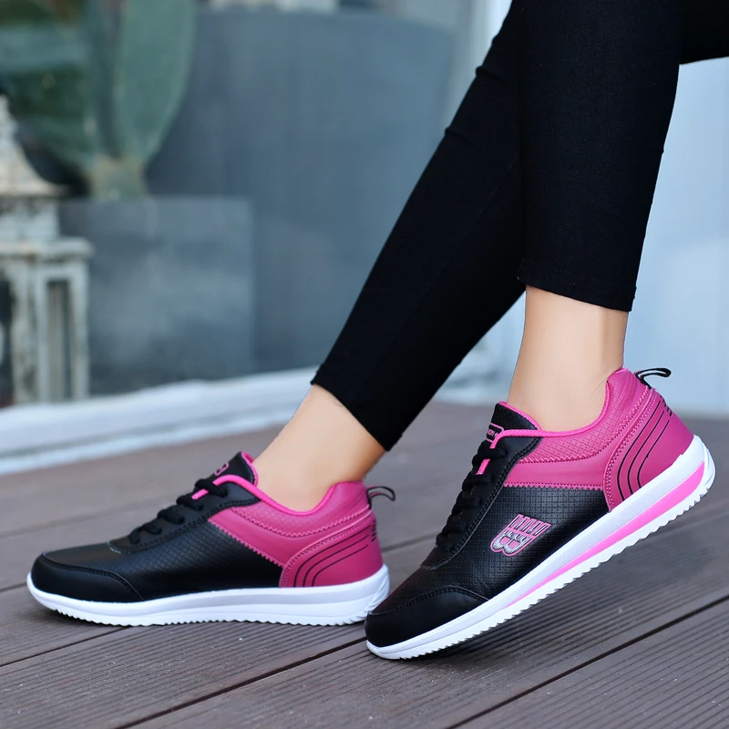 PlatiNum Running Shoes brand logo