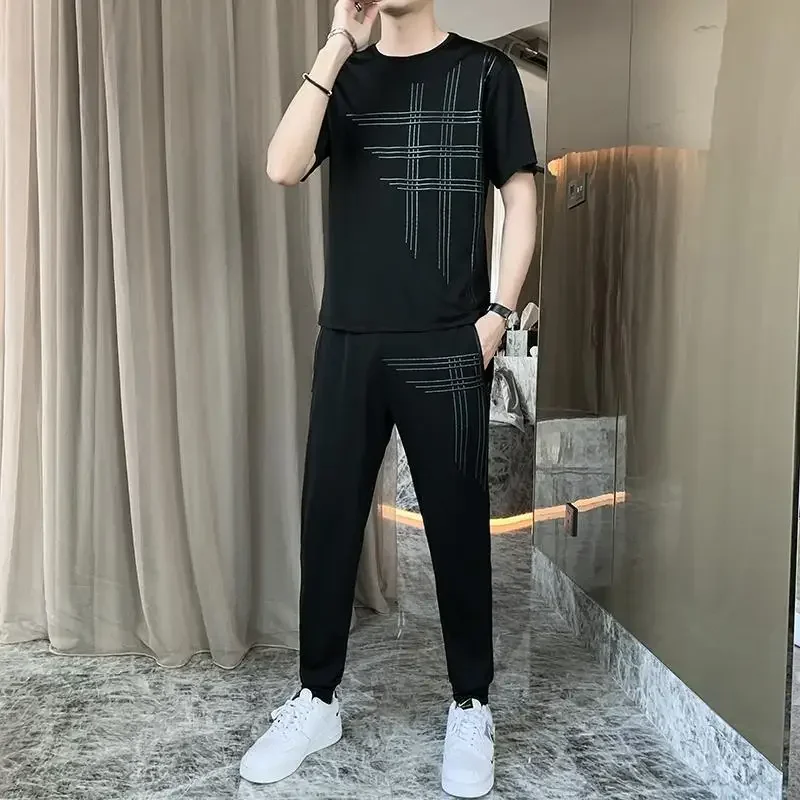 Conjunto de camiseta y pantalones de nailon para hombre, ropa deportiva de gimnasio, de gran tamaño, elástica, de alta calidad, moderna, de dos piezas, camiseta holgada básica