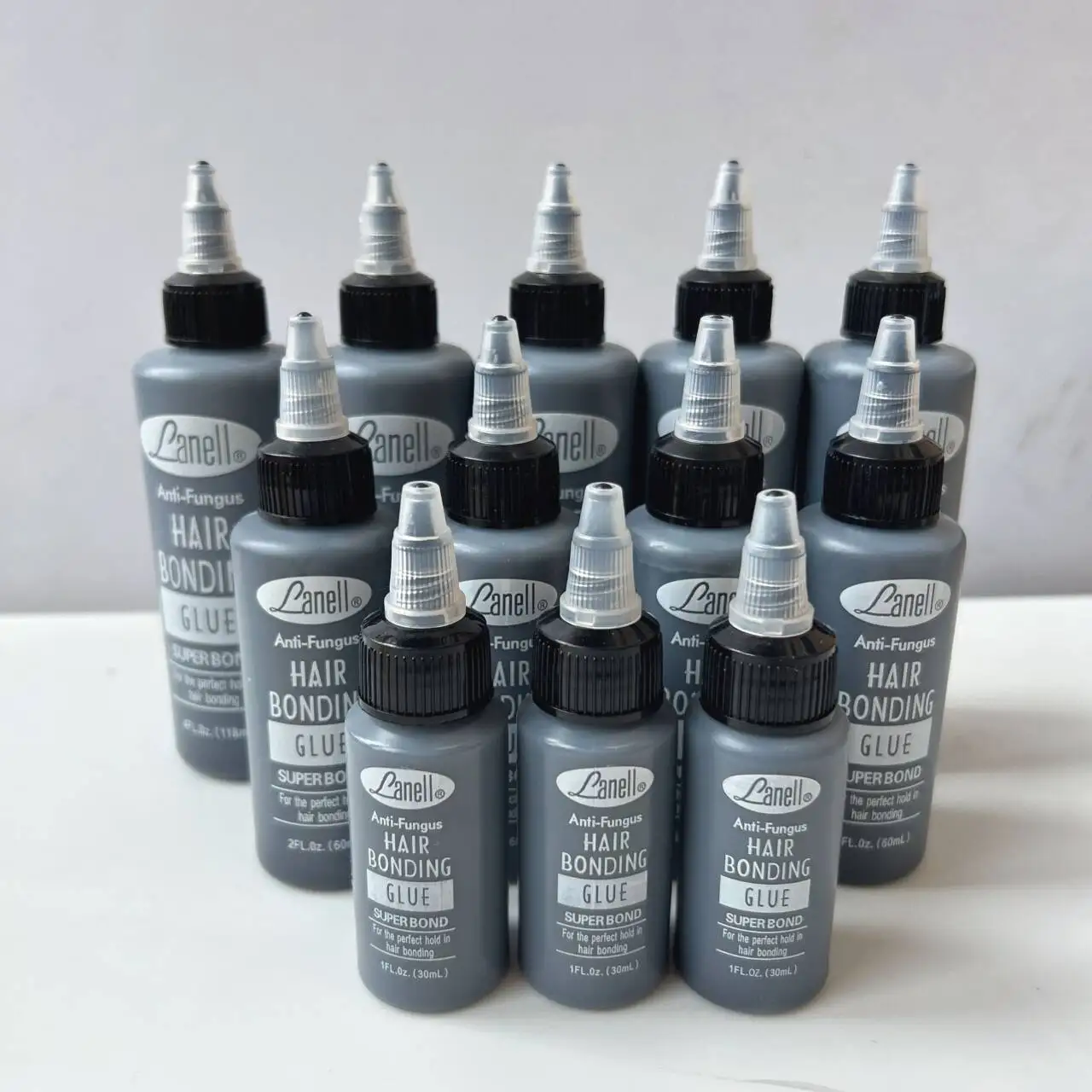 Оптовая продажа, 60 мл, склеивающий клей, оптовая цена, уток волос, клей для париков, вьющихся волос, клей для наращивания черных волос, невидимый клей для волос
