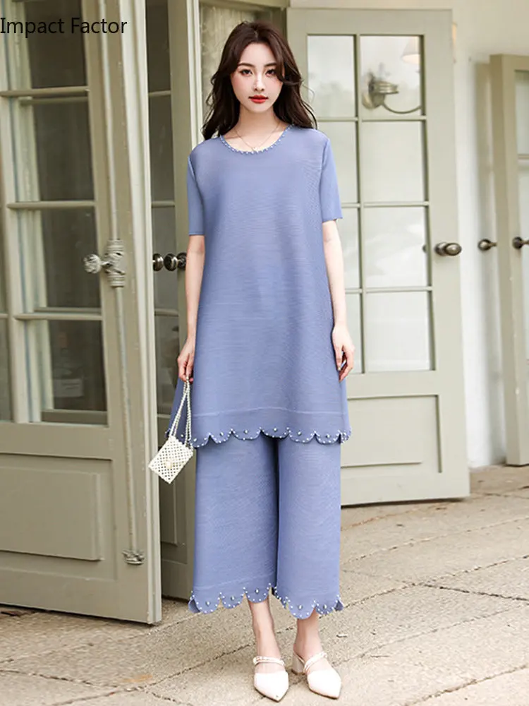 

Товар 2024, СВОБОДНЫЙ Модный комплект из двух предметов в иностранном стиле, элегантные брюки с широкими штанинами и бисером и топ средней длины с короткими рукавами