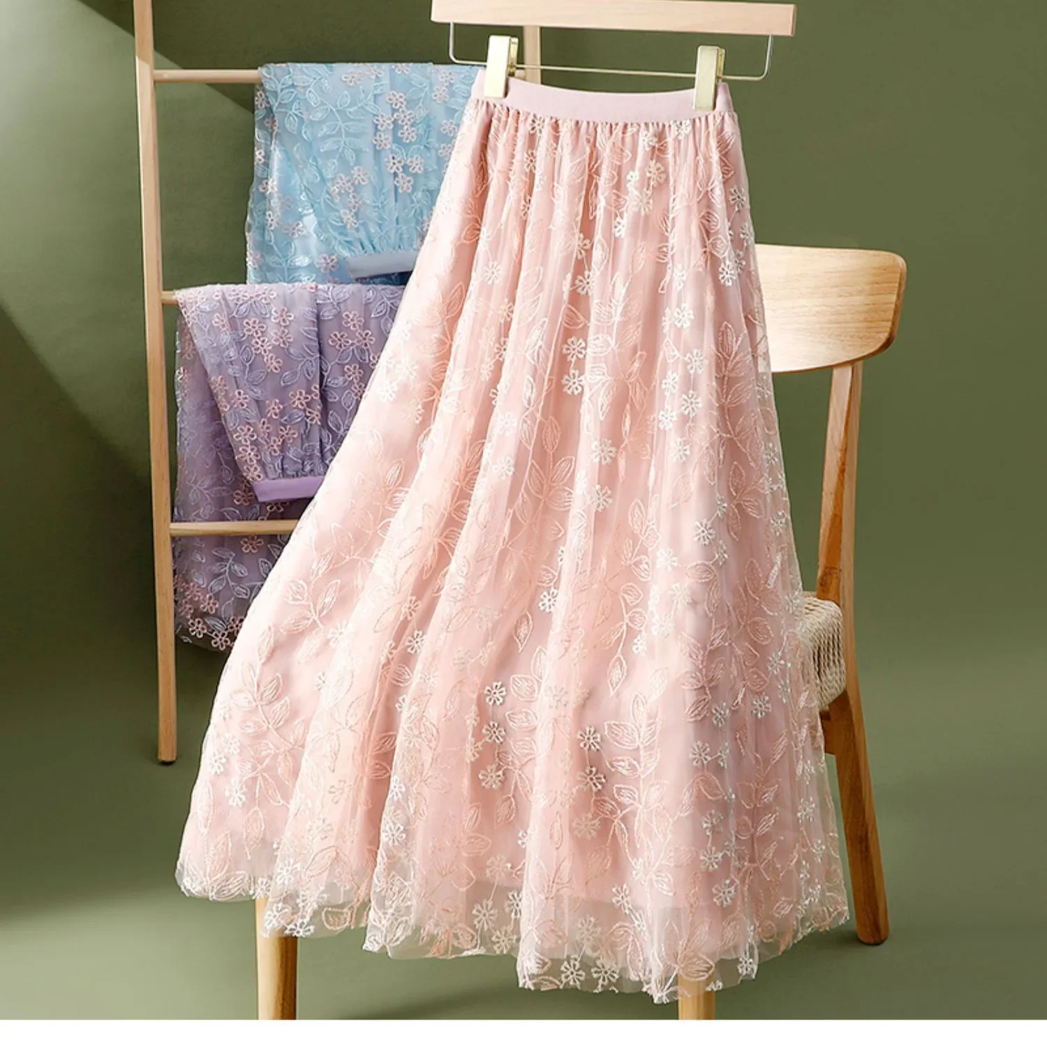 Elegant embroidered floral sheer half skirt A-line midi umbrella skirt for women summer slimming big hemline polyester fibers.
