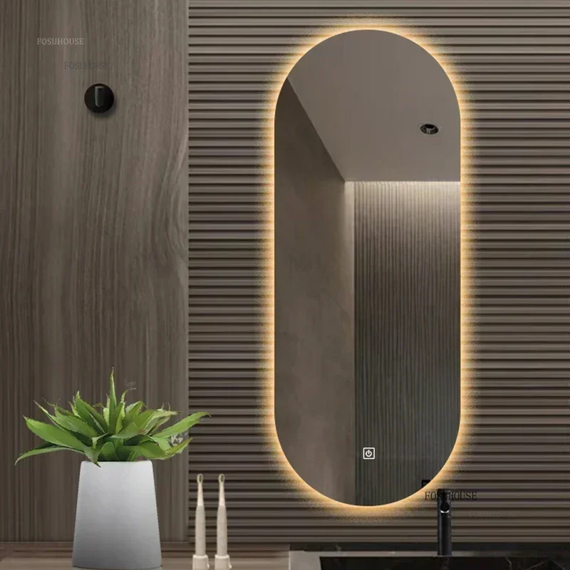 กระจกห้องน้ําที่ทันสมัยสร้างสรรค์สําหรับสํานักงานกระจกหน้าจอสัมผัสส่องสว่างรูปไข่ใหม่กระจกติดผนังขั้นสูงอัจฉริยะสําหรับห้องน้ํา 1