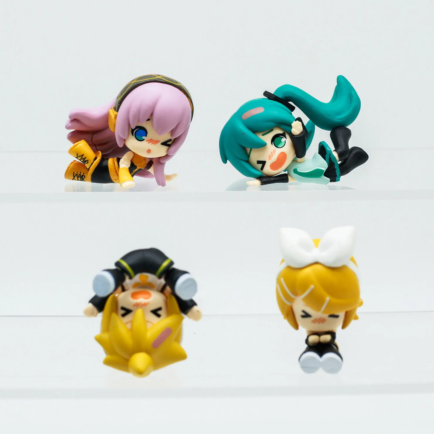 Kawaii Vocaloid Singer Capsule Toy - Cute Anime Figure in Fallen Pose with Blue Hair Ornament