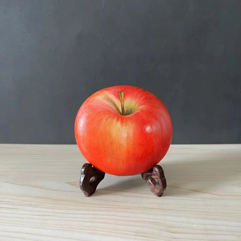 Painted white stone, apple stone, children's handmade drawing, hand drawn circular stone