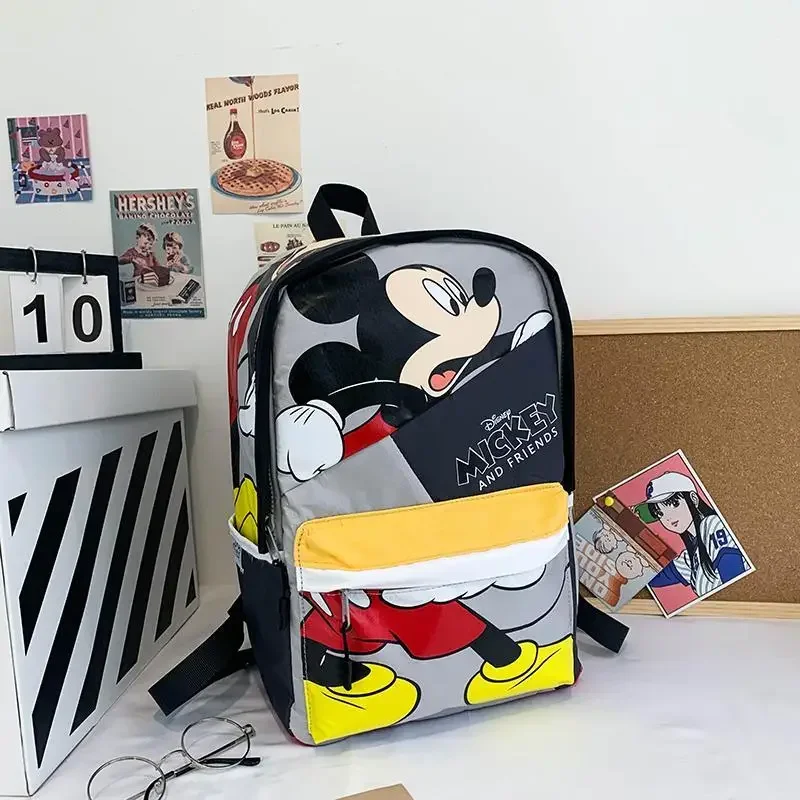 

Disney New Mickey Mouse School Bag College Cartoon Cute and Lightweight Printed Backpack for Boys and Girls