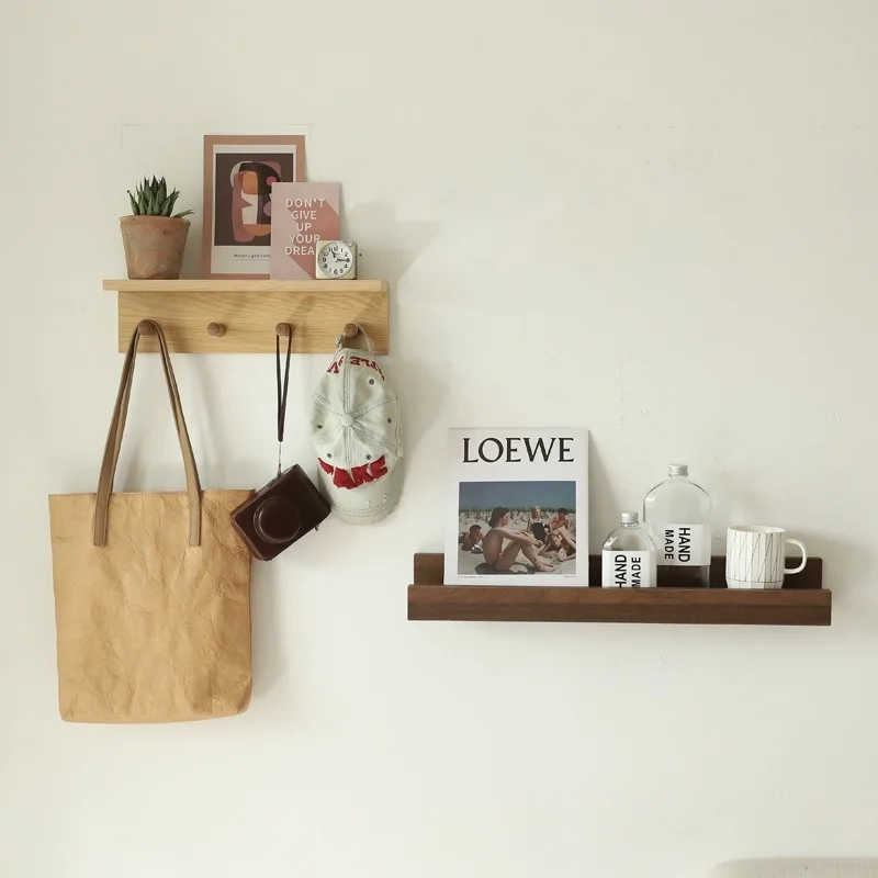 There is a small wooden frame on the wall, a flat partition in the bedroom and kitchen, and a