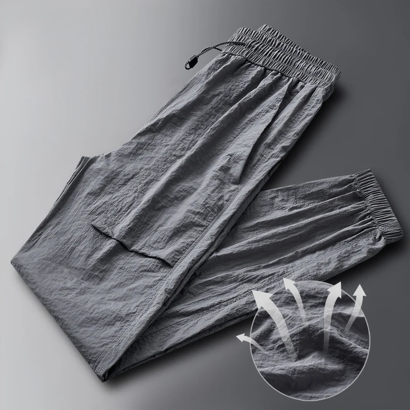 Fashion Elastic Pockets Spliced Solid Color Casual Pants Men's Clothing 2024 Summer New Loose Young Style High Waist Pants
