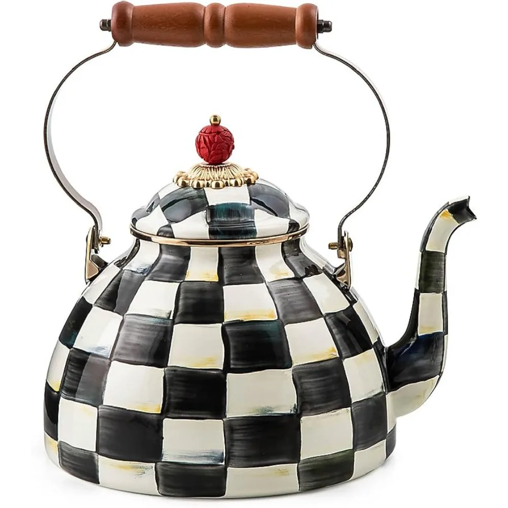 A Vintage Black and White Kettle with a wooden handle for tea time.