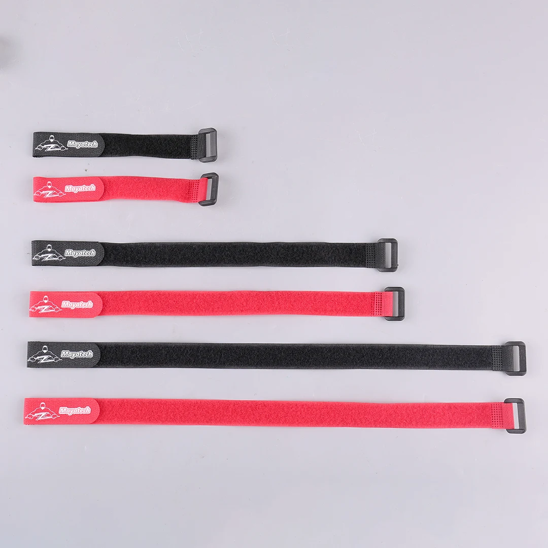Détail des sangles velcro auto-agrippantes pour modélisme, avec mesure de la longueur de 20 cm visible.