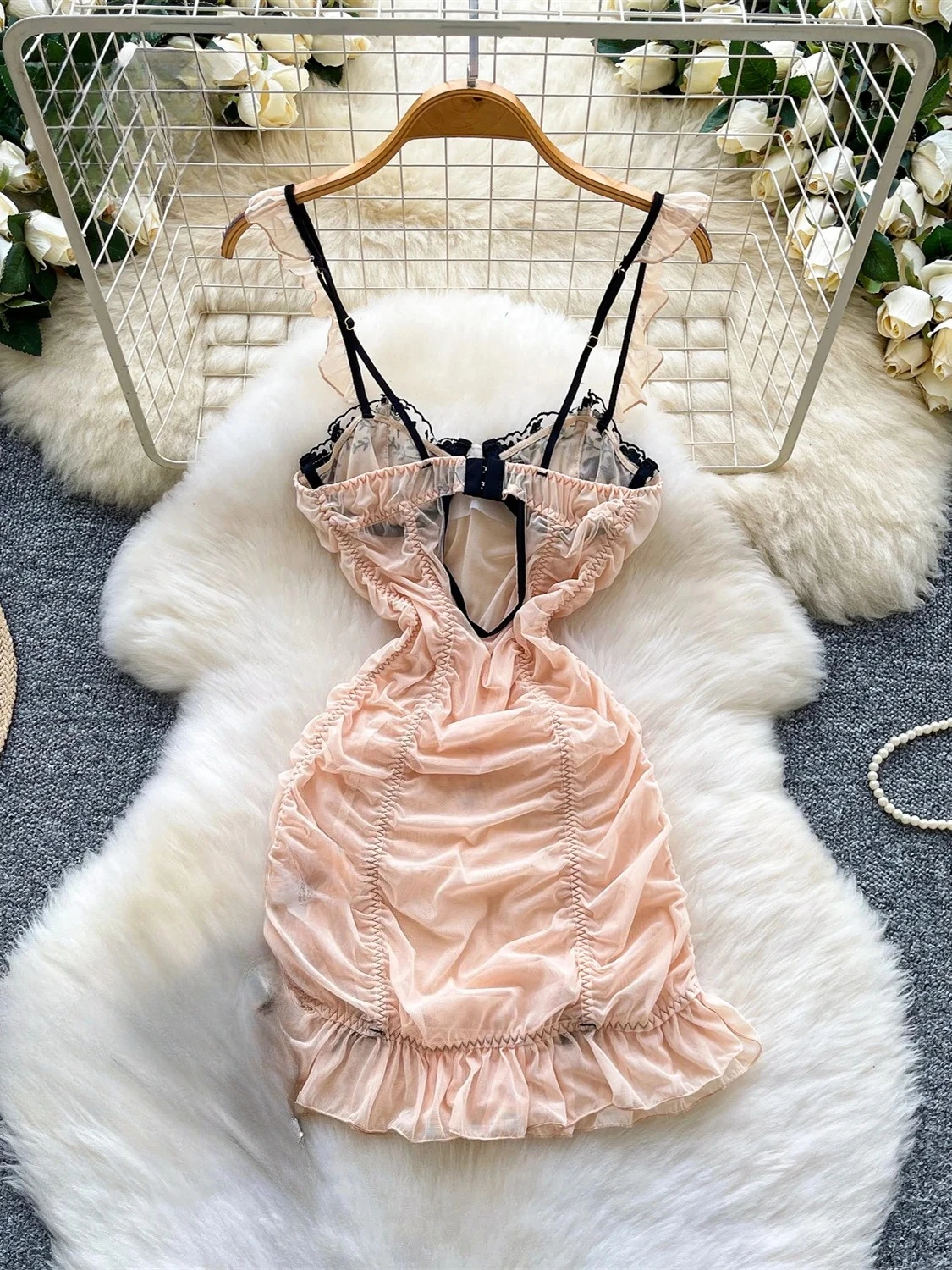 Embroidered mini dress with strapless neckline, slim fit, and elegant feminine detail