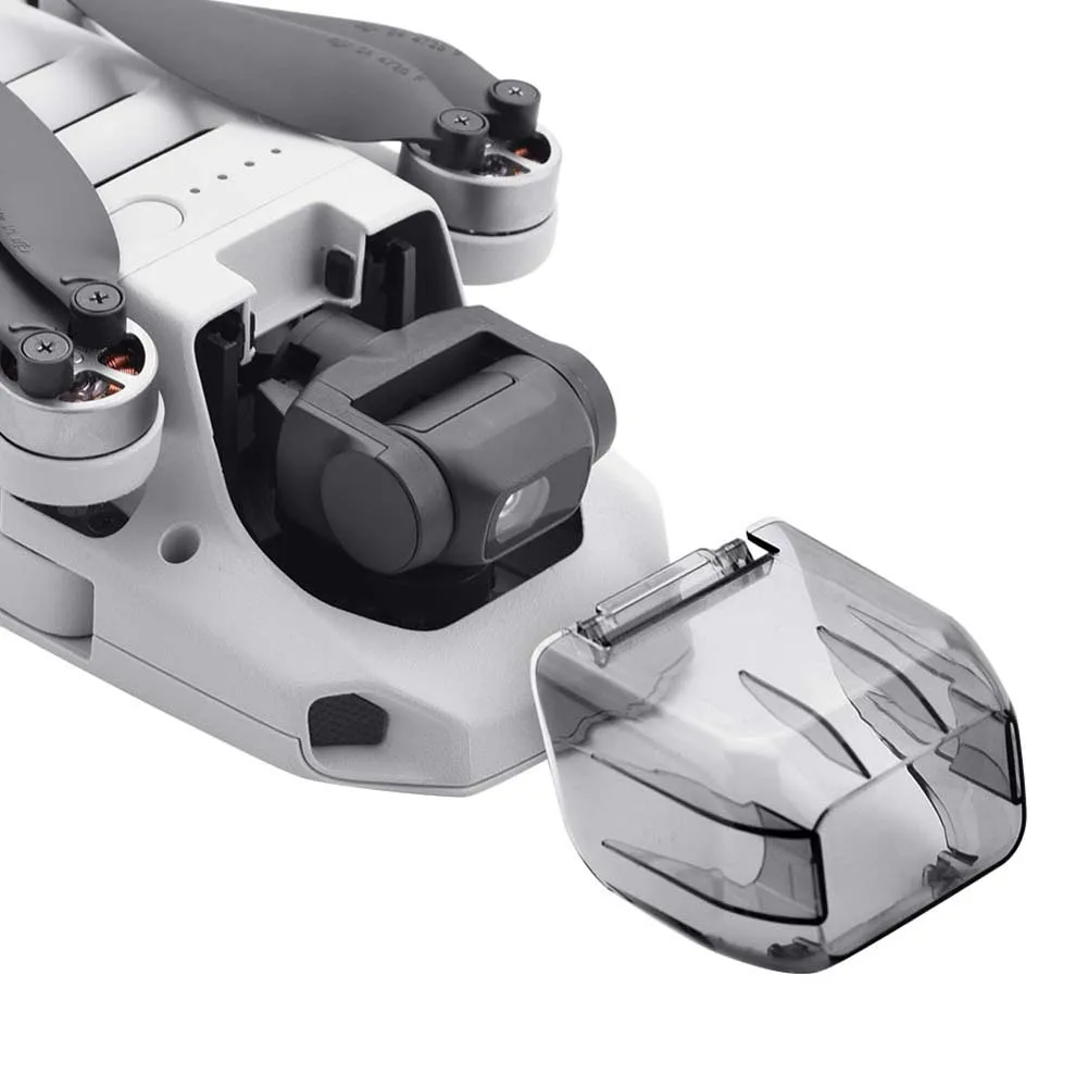 Le capuchon de protection pour drone Mavic Mini posé à côté du drone, montrant sa conception anti-rayures.