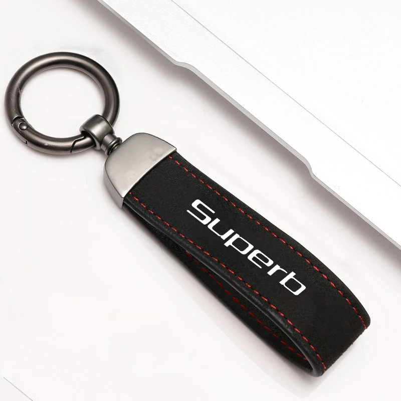 Elegant Metal and Suede Car Keychain with Emblem Design