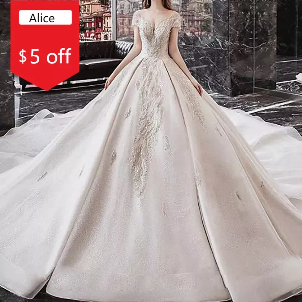 

Luxury Ball Gown Tulle Wedding Dress Off-Shoulder Short Sleeves O Neck Beading Crystal Sequins Chapel Train Vestido Bridal Gowns
