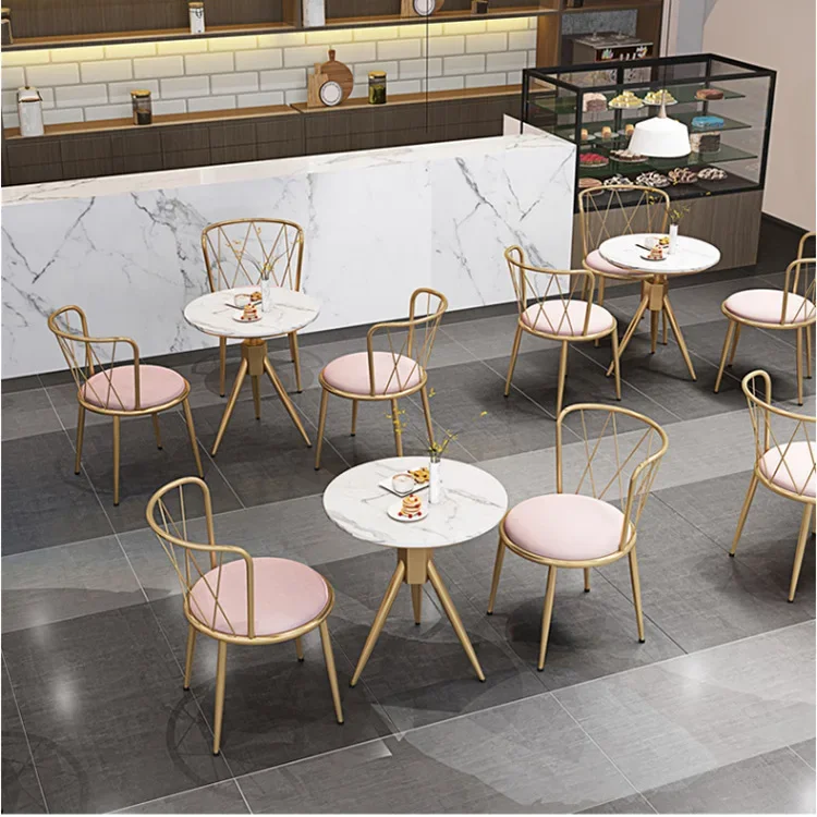 pink velvet fabric chair with gold legs and round table with marble top coffee shop furniture chairs and tables