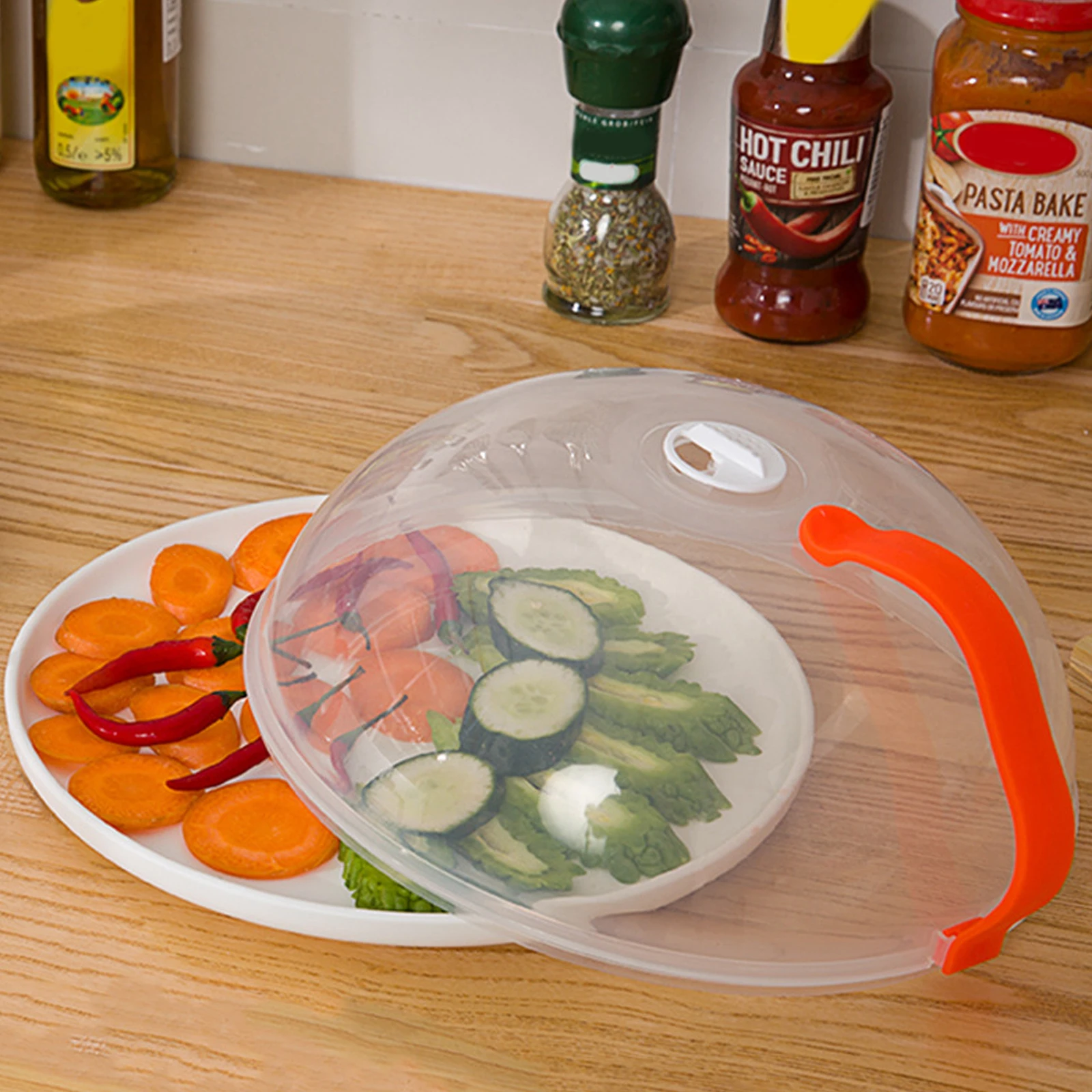 https://ae01.alicdn.com/kf/S294ded4fdb9249d4ae26baedfc7f0422z/Transparent-Microwave-Cover-With-Rotatable-Vent-And-Anti-scalding-Handle-High-Temperature-Resistance-Kitchen-Tool.jpg