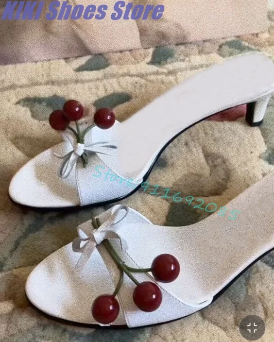 

Sweet cherry bouquet decorated with simple white sandals and pointed toe open toe stiletto heels