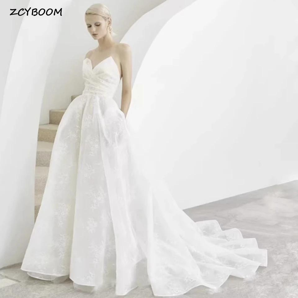 

Charming Strapless Lace Sleeveless Wedding Dresses 2023 Floor Length Sweep Train Sweetheart A-Line Open Back Zipper Bridal Gown