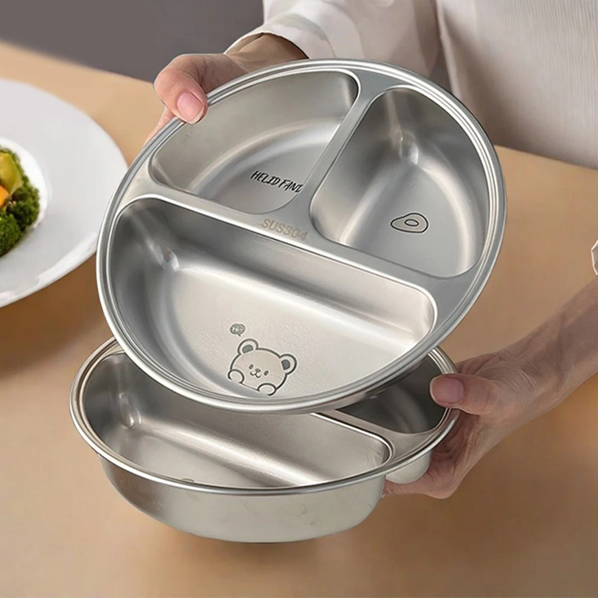 Polished stainless steel round dinner plate for home and camping.