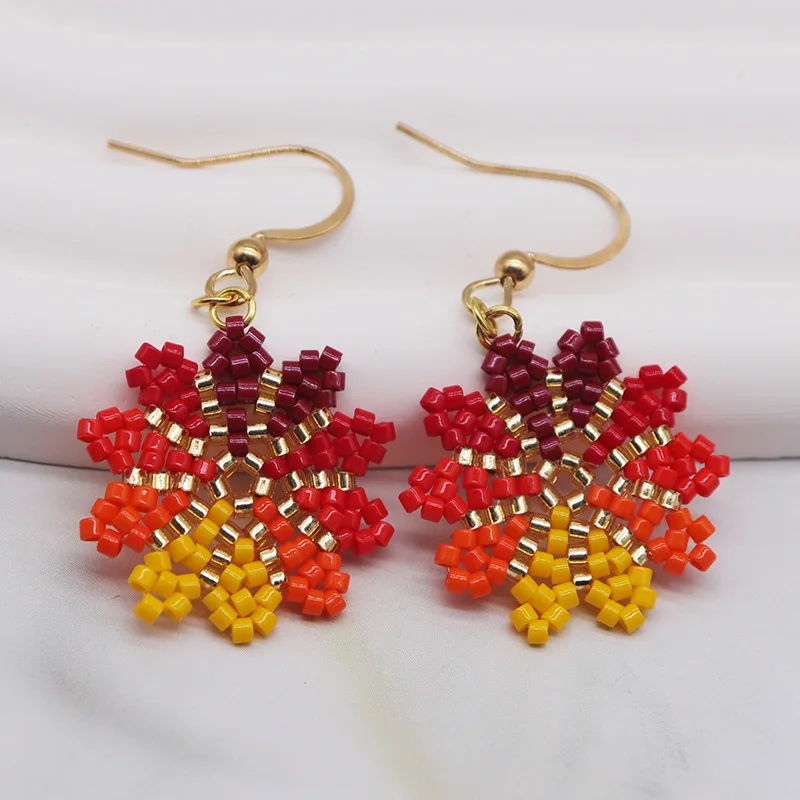 

Rice bead earrings Snowflake Hollow out Originality Colour Design Hand knitting Bohemia Alloy Fashion Simple Beaded earrings