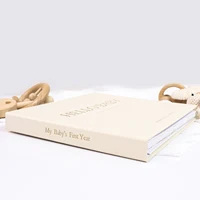 ERATOPIC Baby Memory Keepsake Book - Linen Fabric with Golden Logo and Milestone Stickers