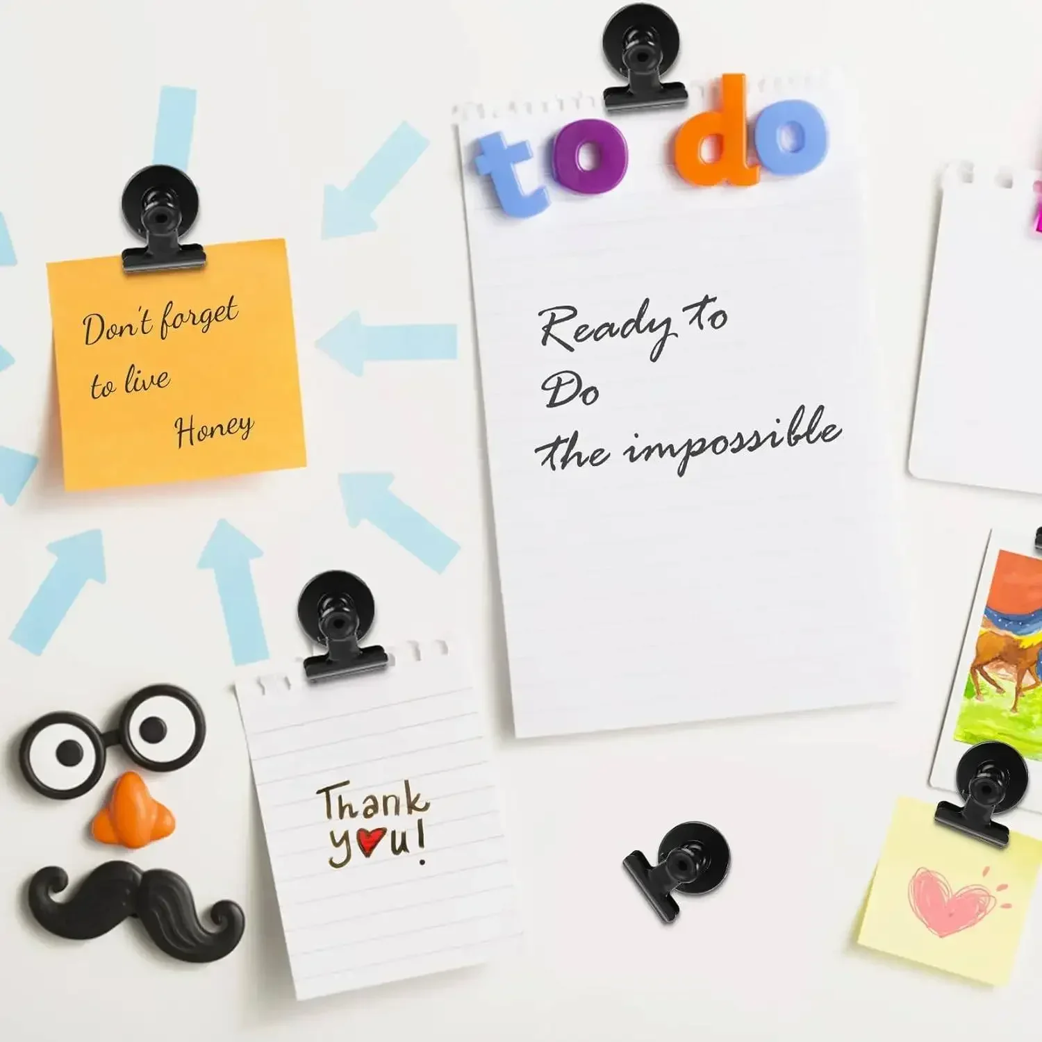 Magnetic bulldog clips used on an office cabinet for documents and reminders