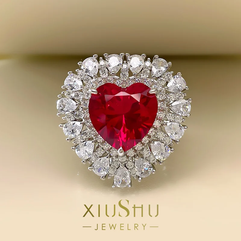 

Luxurious Artificial Dove Blood Ruby Ring with Heart-shaped Full Diamond Inlaid Fire Colored Sapphire Index Finger Ring