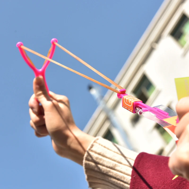 Flying Toy 1/3/5/10/20/50/100pcs Light Toy Arrow Rocket Helicopter Flying Toy LED Light Toys Party Fun Gift Rubber Band Catapult