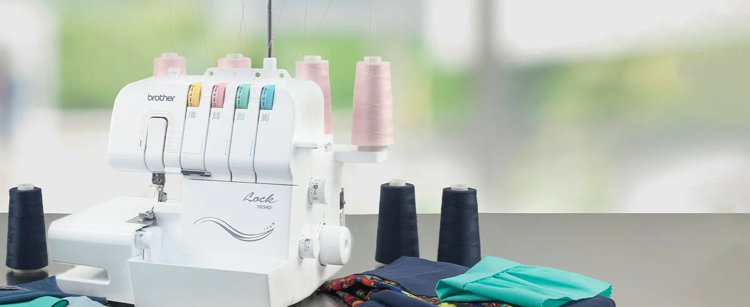 Serger on sewing table with cones of thread