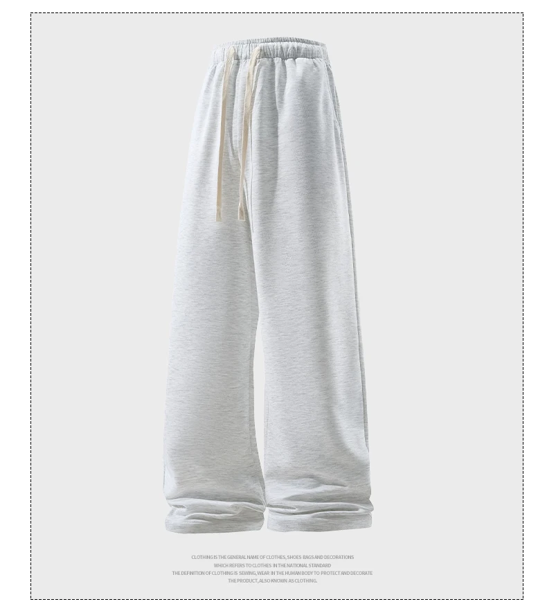 Man wearing loose wide-leg sweatpants with drawstring waist in a casual autumn streetwear setting L gray