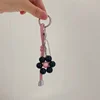 New South Korea Dongdaemun Gentle Cream Colored Leather Rope Contrasting Sun Flower Beads Phone Chain Keychain Bag Pendant 4