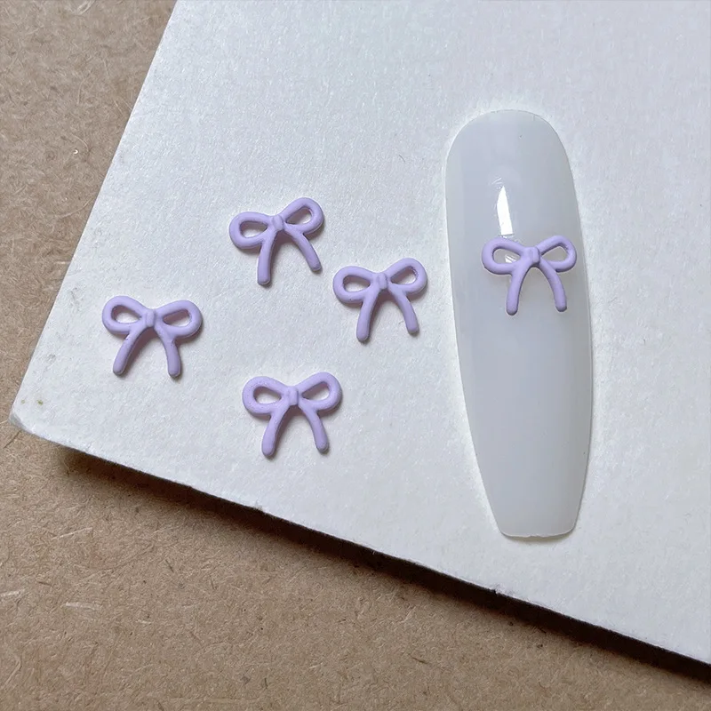 10pcs 새로운 일본식 스프레이 페인트 활 네일 아트 매력 액세서리 간단하고 다목적 마카롱 컬러 보우 네일 장식