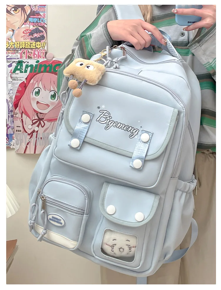 حقيبة ظهر جديدة لعام 2025 لطلاب المدارس الثانوية والمدرسة الابتدائية حقيبة ظهر مدرسية متعددة الاستخدامات مع دمية