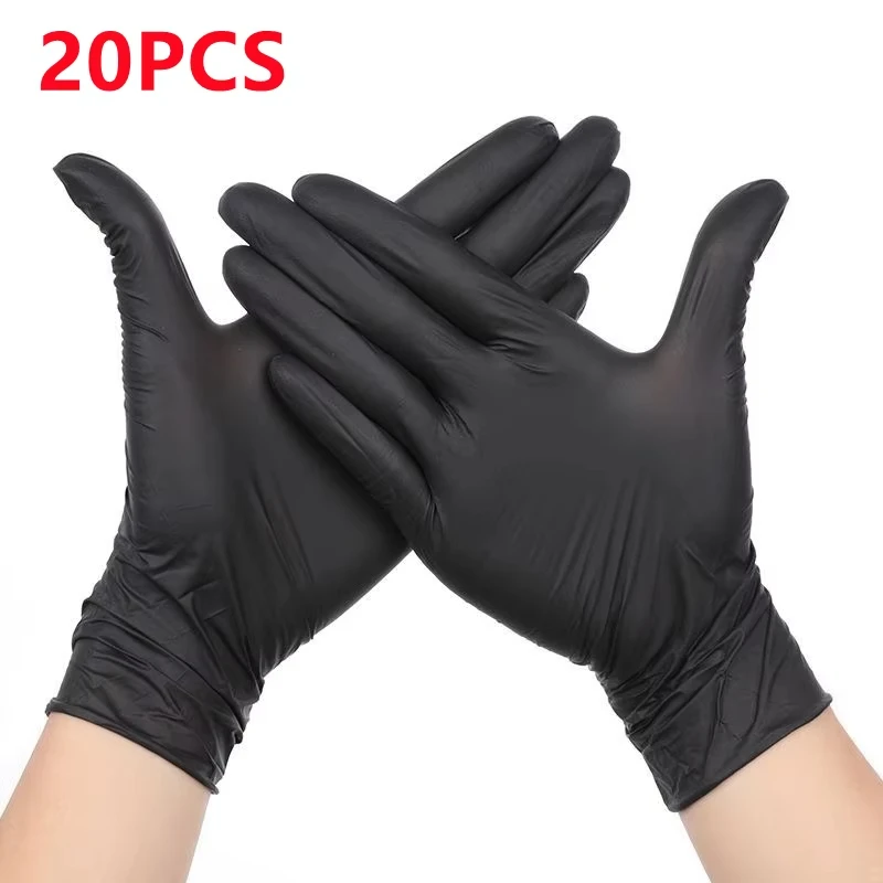 Gants jetables noirs posés à plat, vue de dessus montrant la texture.