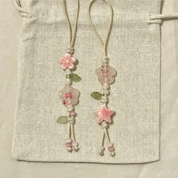 Simpatico cinturino con ciondolo per telefono con fiore a forma di stella, cordino per telefono con perline in ceramica Kawaii, colori pastello per ciondolo per fotocamera per borsa da ragazza
