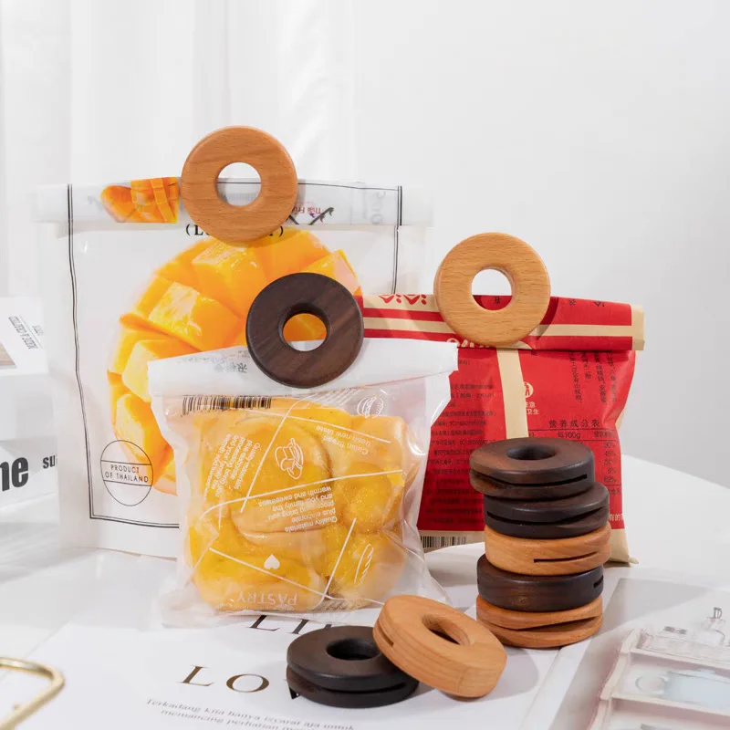 https://ae01.alicdn.com/kf/S2c6bdd60f66649a382a5a6be4f1ab702T/Natural-Round-Donuts-Bag-Clip-Black-Walnuts-Wooden-Sealing-Clips-Creative-Biscuit-Shaped-Fashion-Kitchen-Tools.jpg