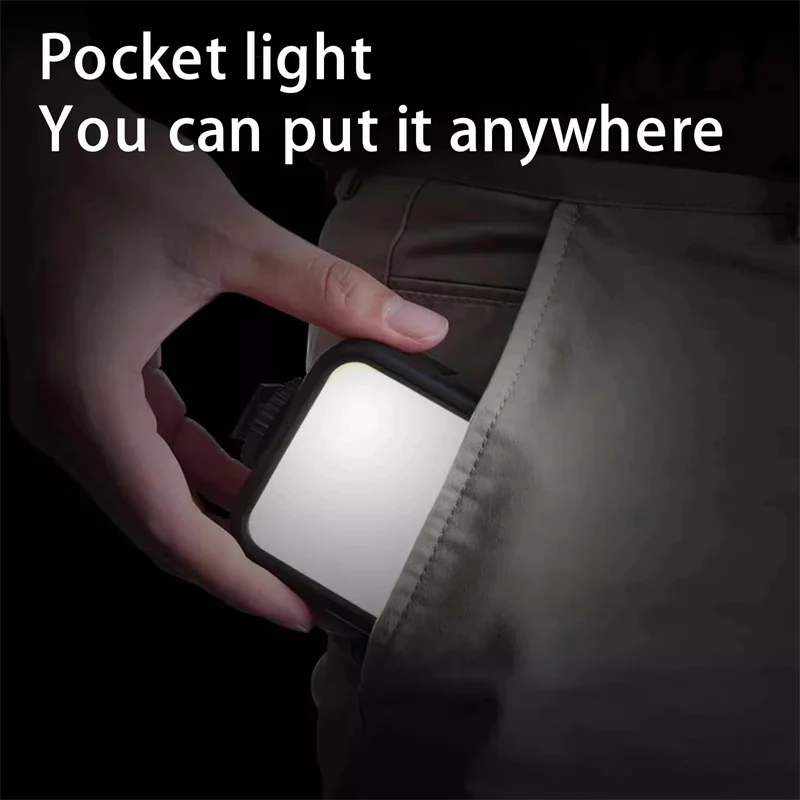 Lampe LED bicolore posée sur une table, avec télécommande et câble USB, prête pour tournage vidéo.