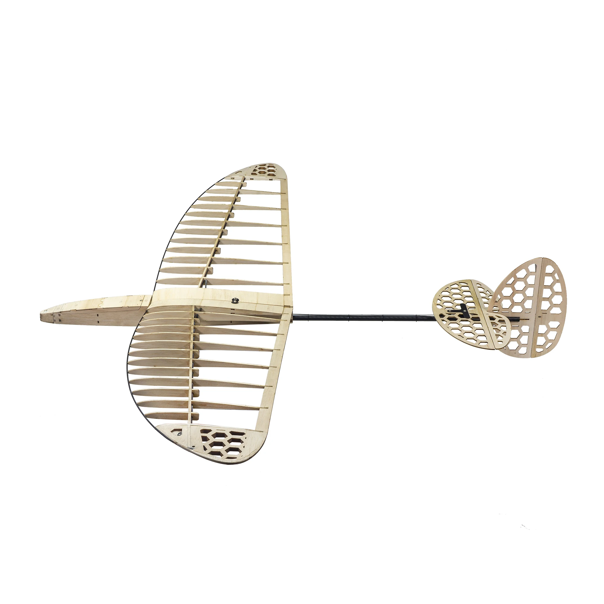 Planeur RC 2.4GHz 3CH avec gyroscope posé sur l'herbe, conçu pour voltige et débutants