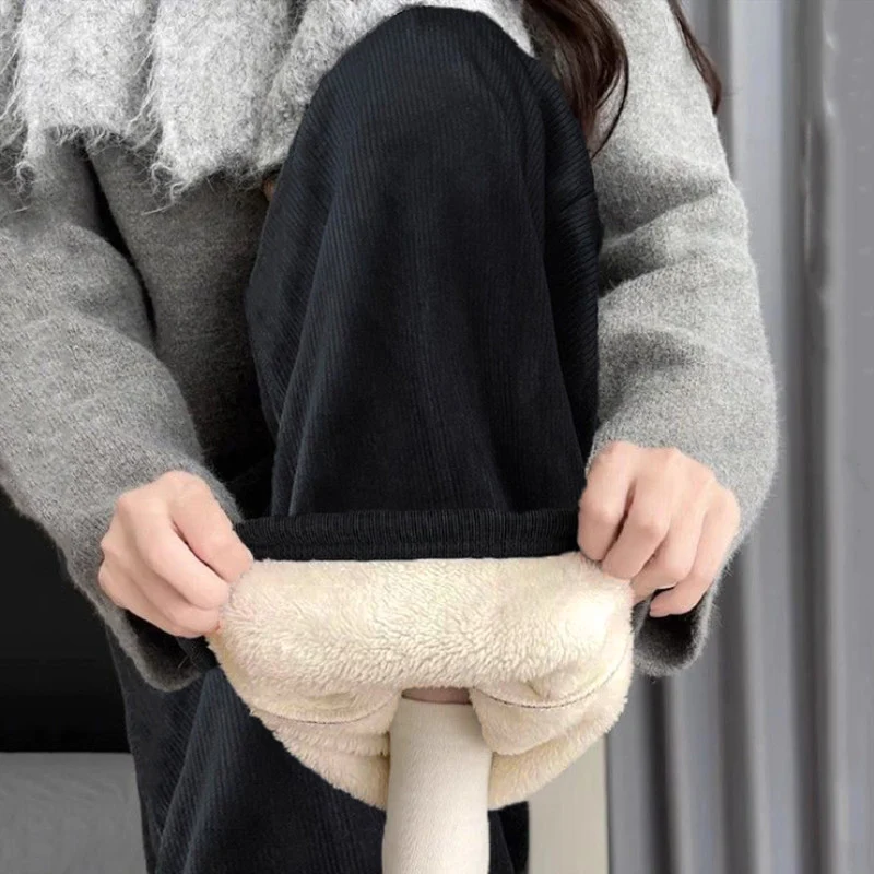 Lambswool corduroy wide-leg pants black. no pockets. slightly yellowish hue