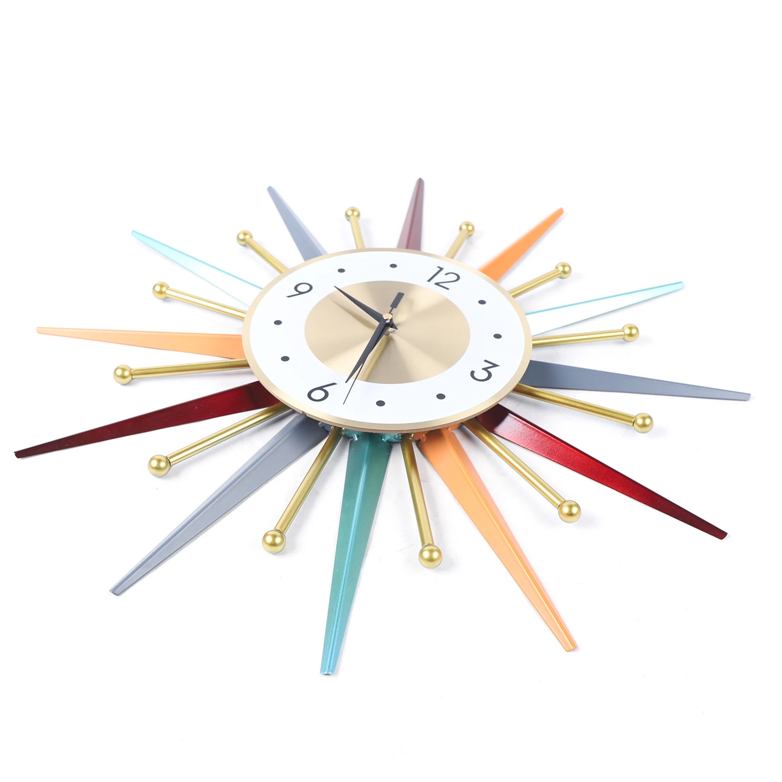 The Sunburst Wall Clock boasts a white and gold face, black hands, and colorful spokes that radiate outward, adding a vibrant retro touch to any modern space.