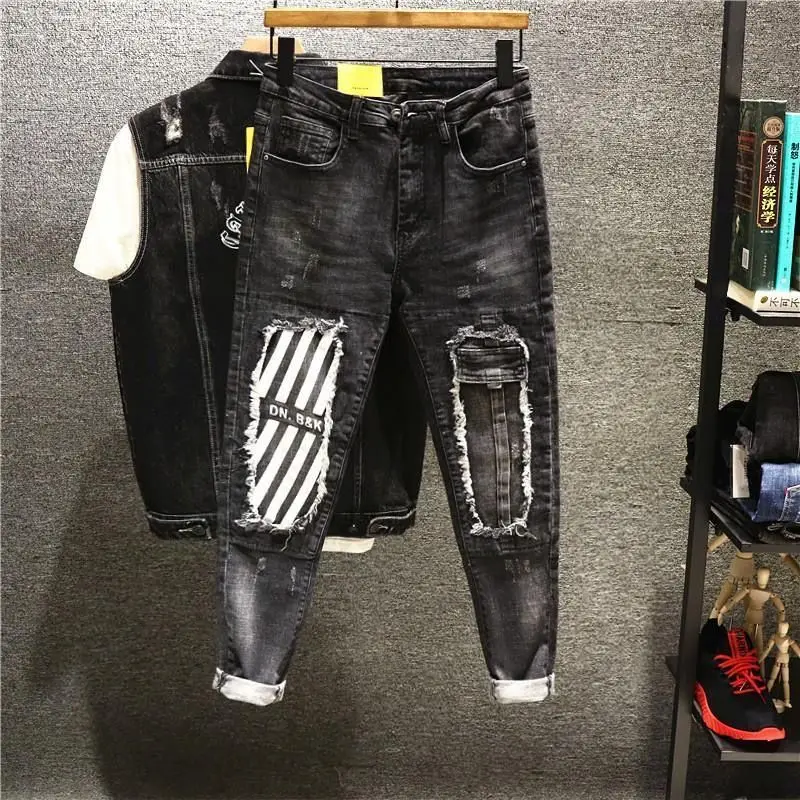 

Men's light blue and black patched jeans with big holes Men's fashion fashion slim fitting beggar trousers ripped jeans